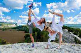 Person practicing yoga in a bright, modern studio.